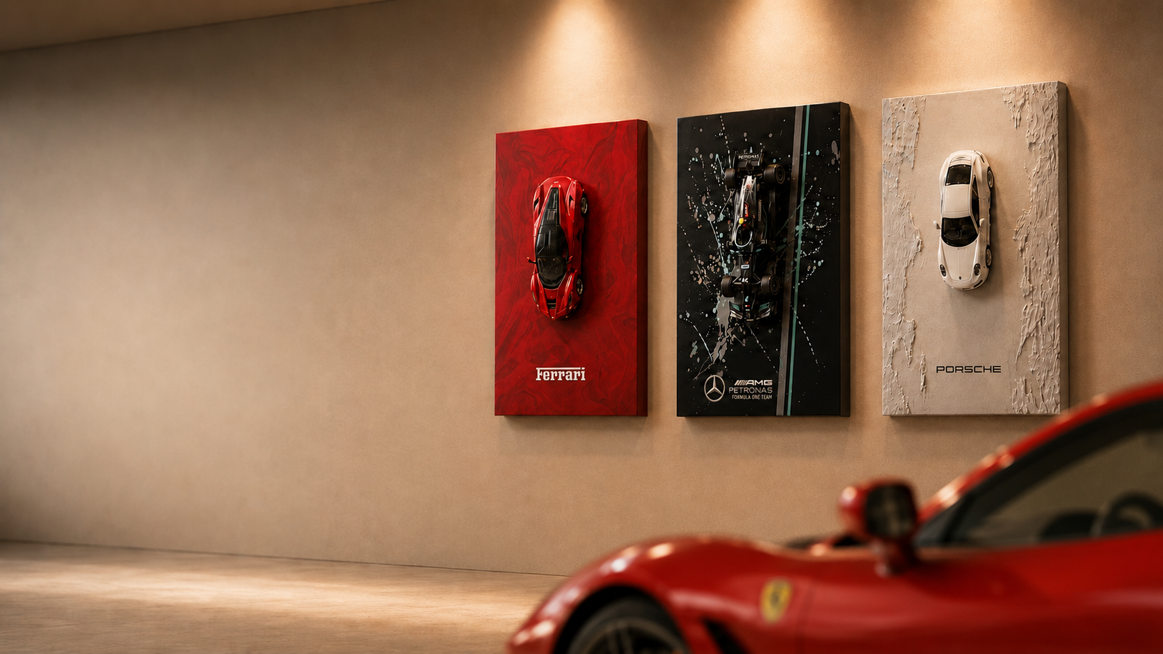Three epoxy car paintings hanging in a dark gallery showroom